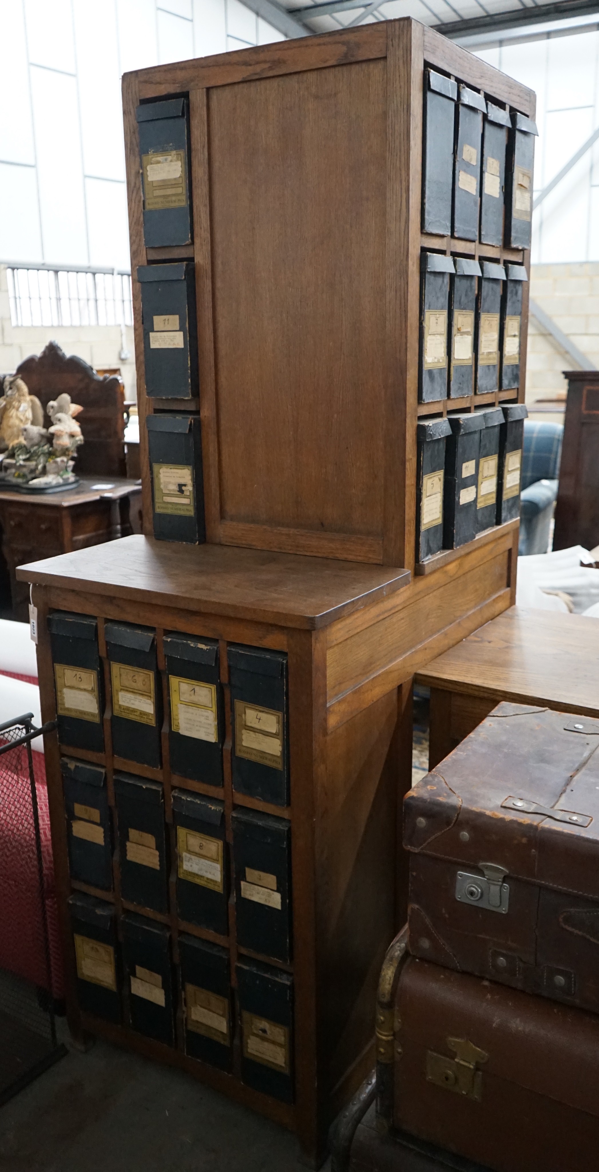 An early 20th century oak stationery desk, width 166cm, height 199cm